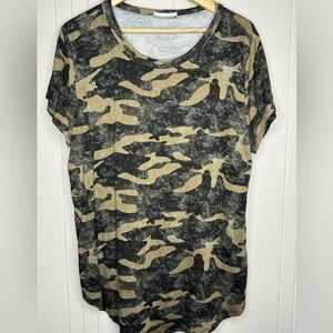 Woman’s shirt tail hem, camouflage print